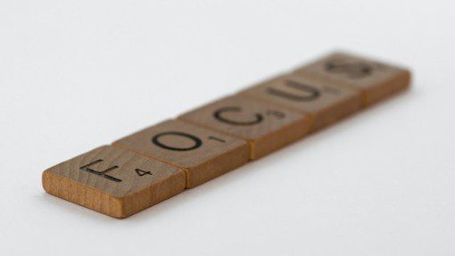 Focus spelled out in wooden Scrabble tiles