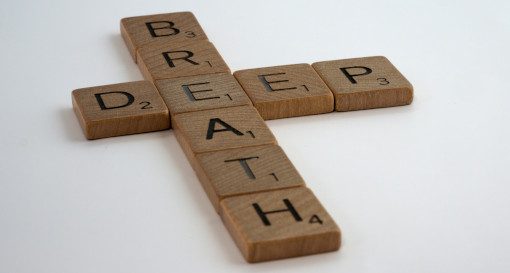 Wooden scrabble tiles spelling deep breath